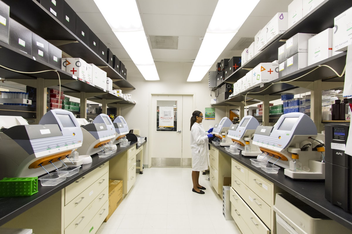 Scientist working with analytical instruments in a modern testing laboratory